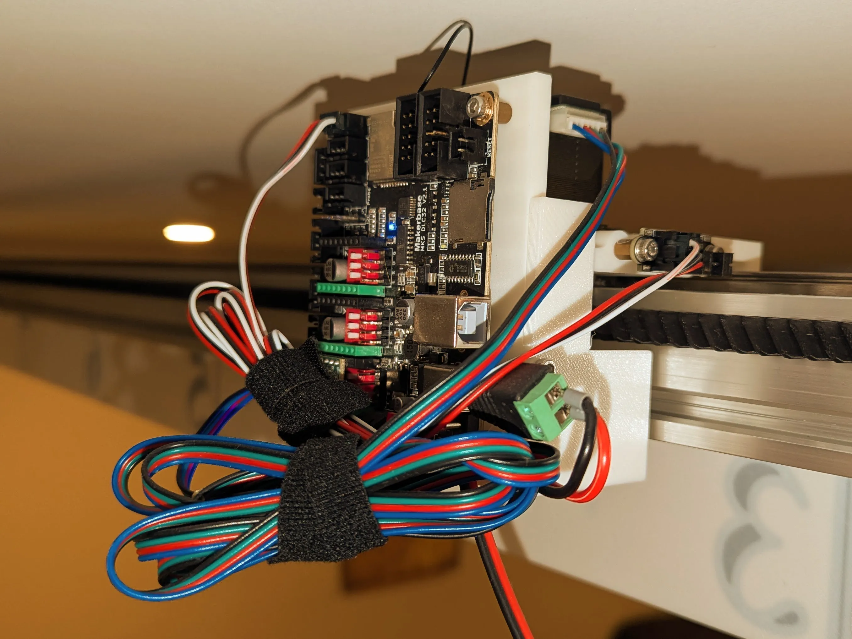 Bare DLC32 board mounted on the back, wiring tidied with Velcro straps